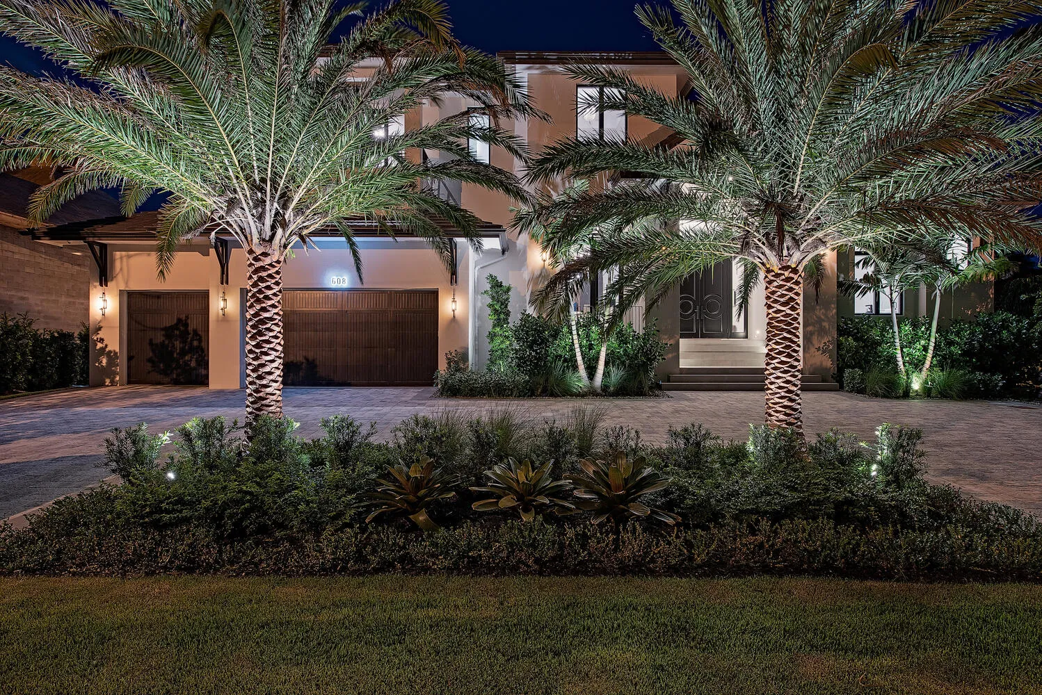 Aqualane Shores Residence: exterior front night drive